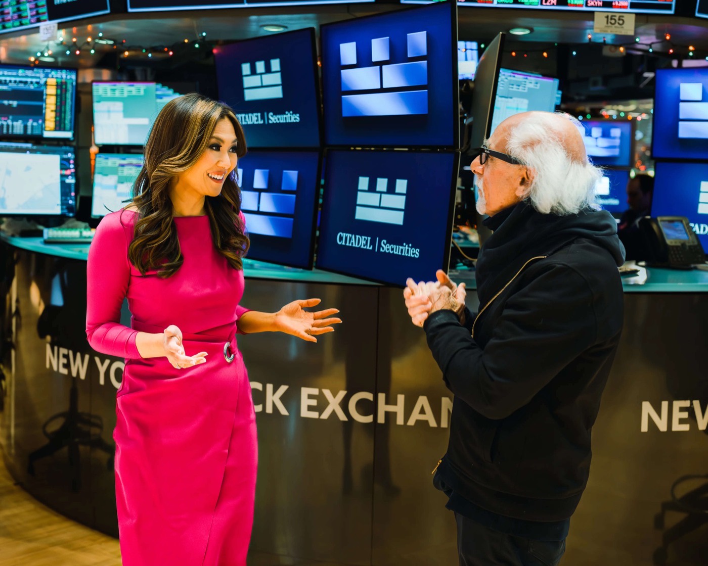 Remy Blaire in conversation on the floor of the New York Stock Exchange